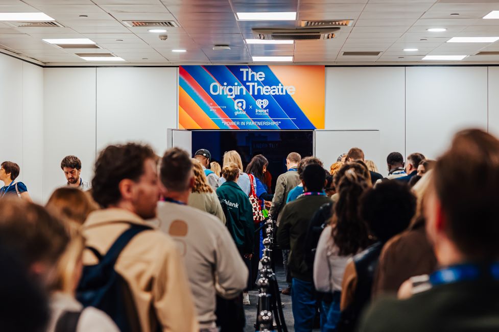Delegates queuing to enter the Origin Theatre stage